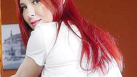 Secretary in a sexy dress and stockings plays her big dildo