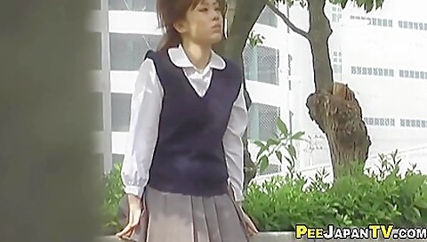 Pissing in the pissing pit for a cute japanese babe