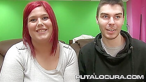 A redhead with big tits and a big ass sucks on a hard cock