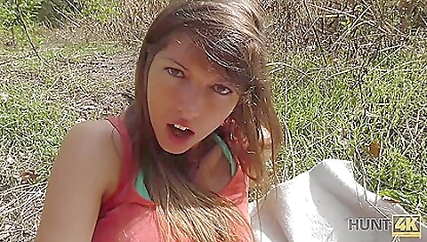 Guy sits on the couch with the girl and then takes her down