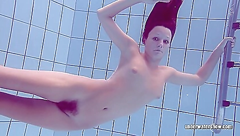 Lucy gurchenko swims nude in the pool in her swimsuit