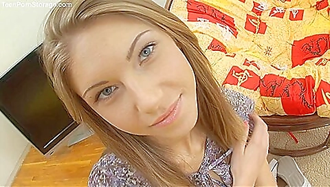 Horny blonde teen is playing with her shaved pussy