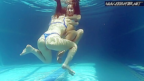 Lesbian threesome with a hot redhead and a slender babe